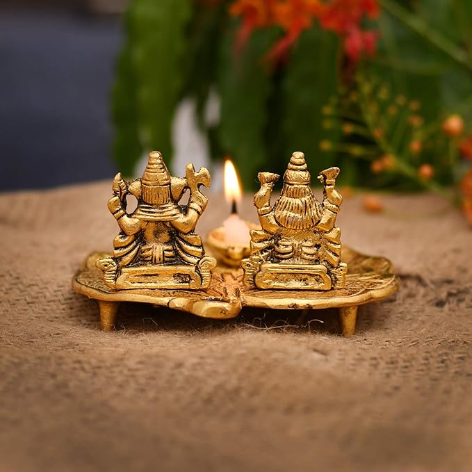 Lakshmi and Ganesha on Leaf with Diya