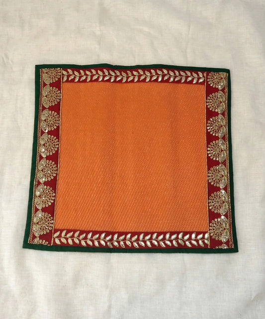 Orange Nylon Handmade Chatai/Mat with Green, Red & Golden sequins work on the Trim/Lace 24x24 (in inch)