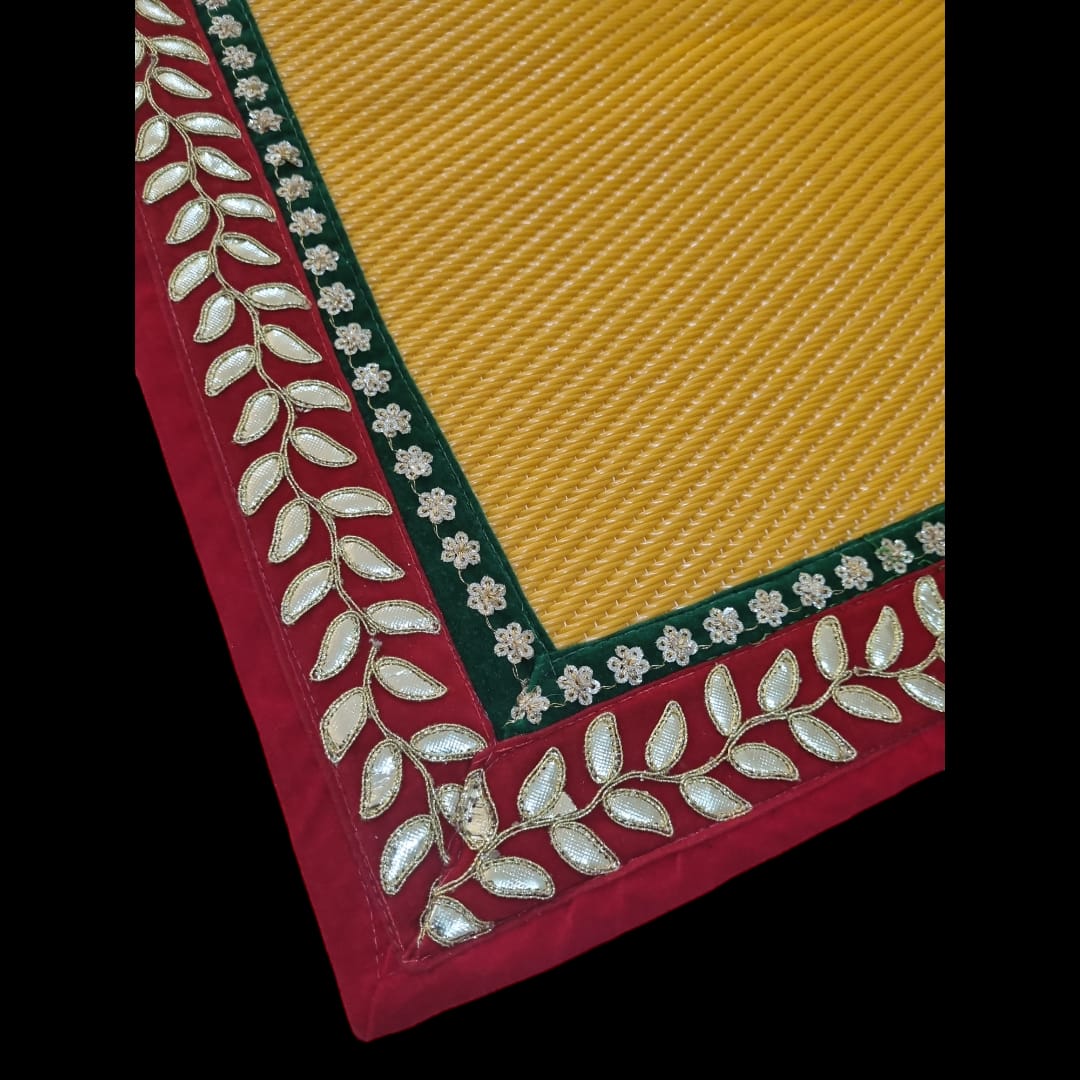 Yellow Nylon Handmade Chatai/Mat with Red, Green & Golden sequins work on the Trim/Lace 24x24 (in inch)