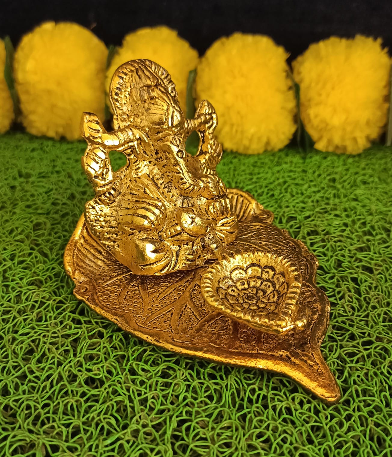 Lord Ganesh Idol Statue On Lotus Flower Diya