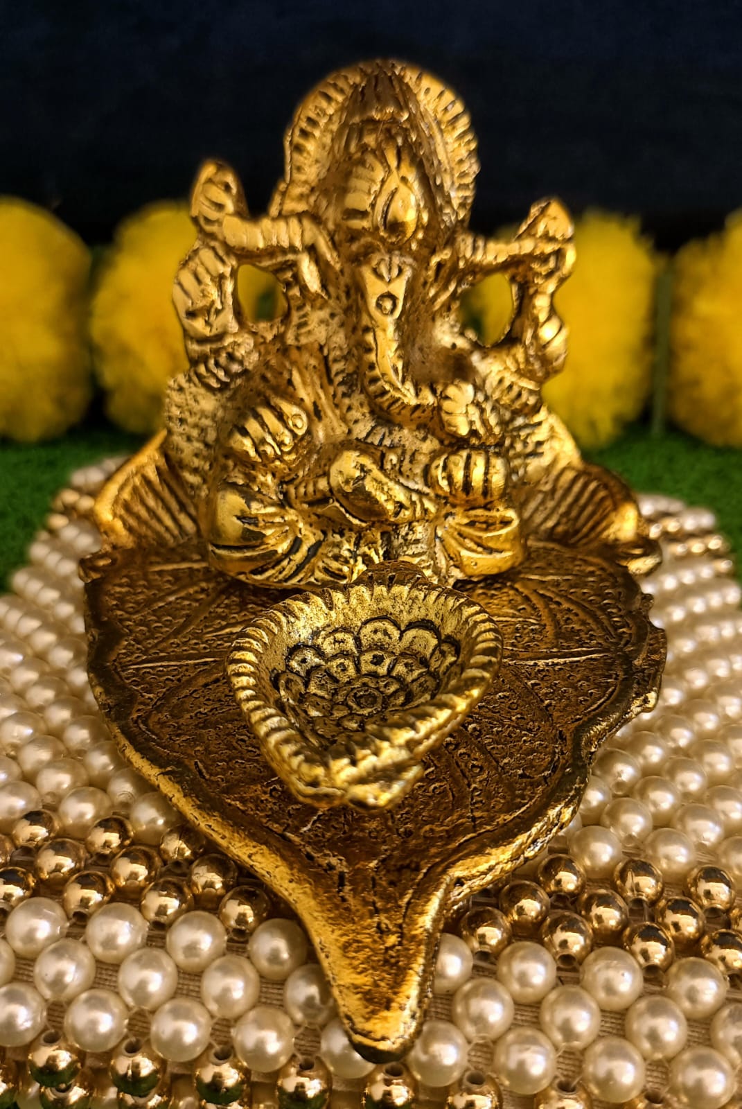 Lord Ganesh Idol Statue On Lotus Flower Diya