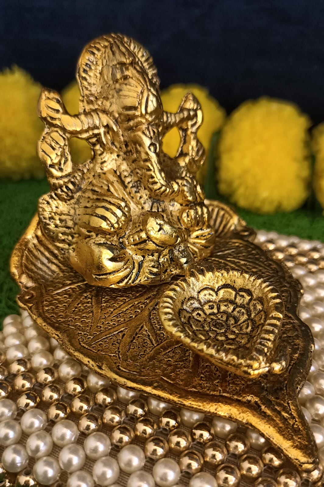 Lord Ganesh Idol Statue On Lotus Flower Diya