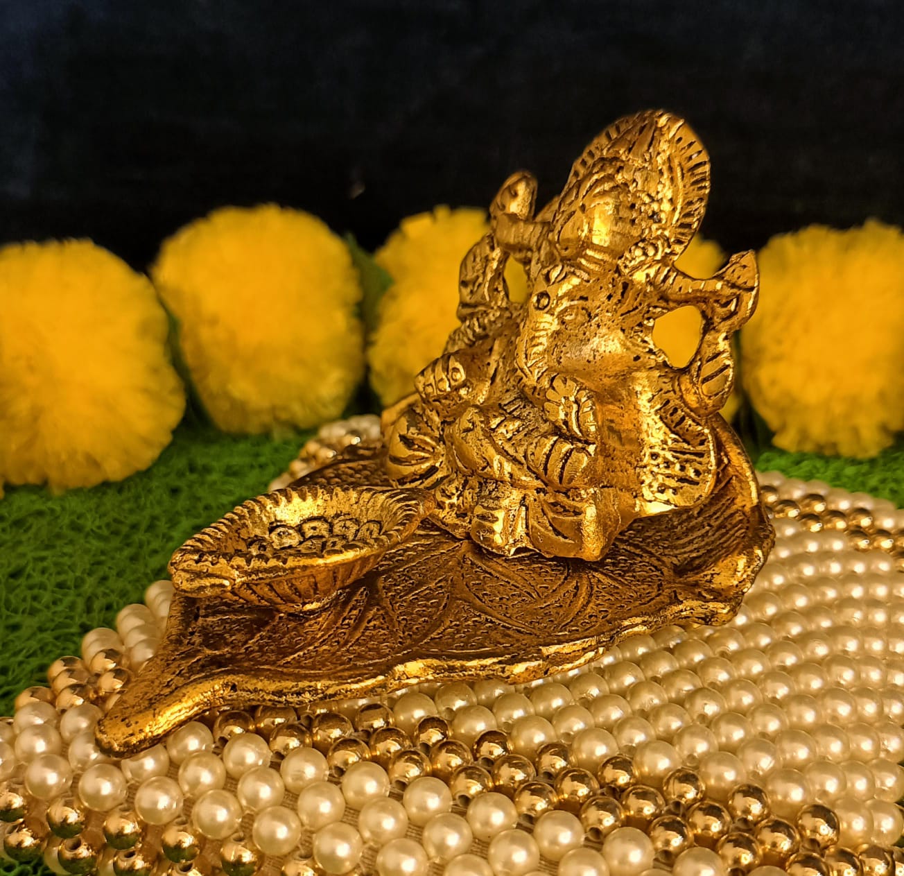 Lord Ganesh Idol Statue On Lotus Flower Diya