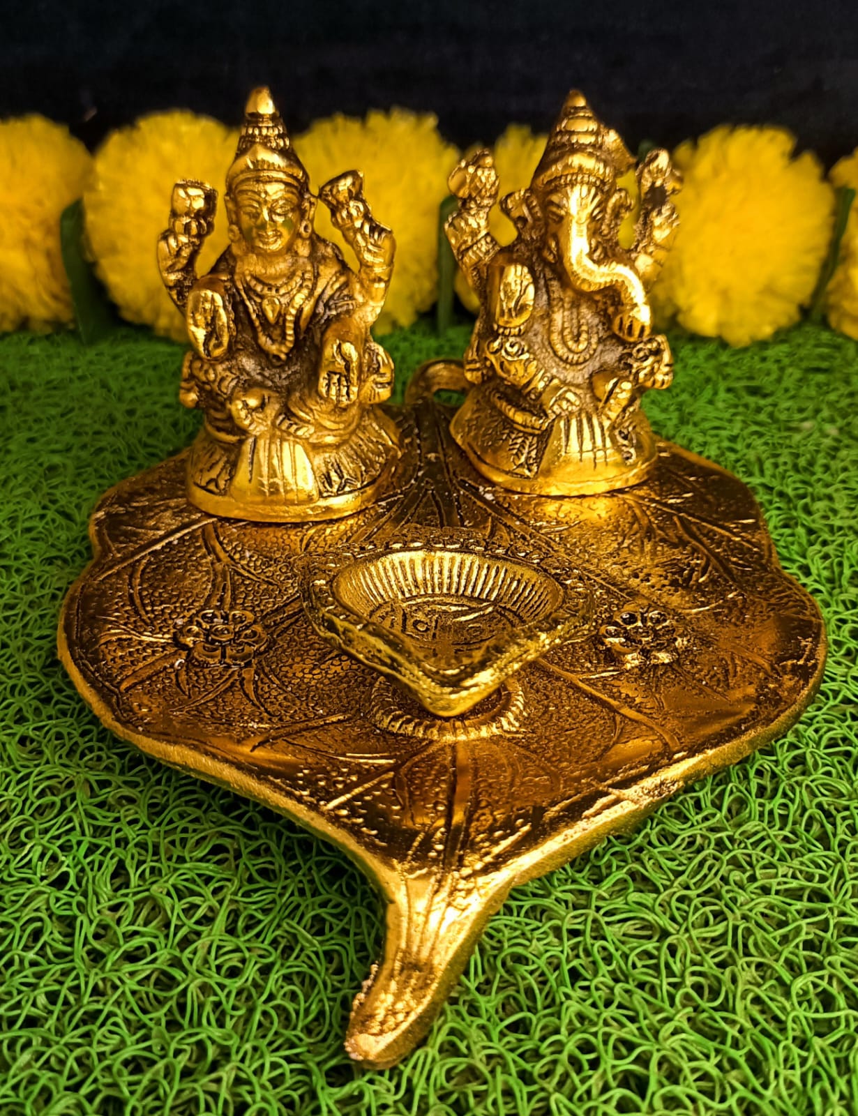 Lakshmi and Ganesha on Leaf with Diya