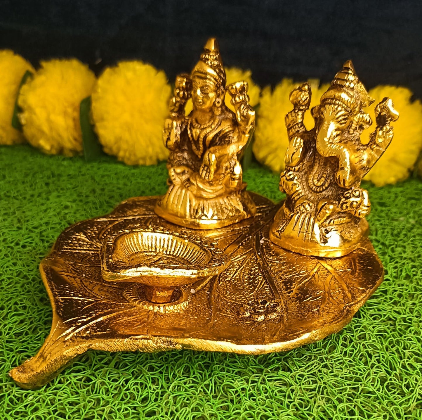 Lakshmi and Ganesha on Leaf with Diya