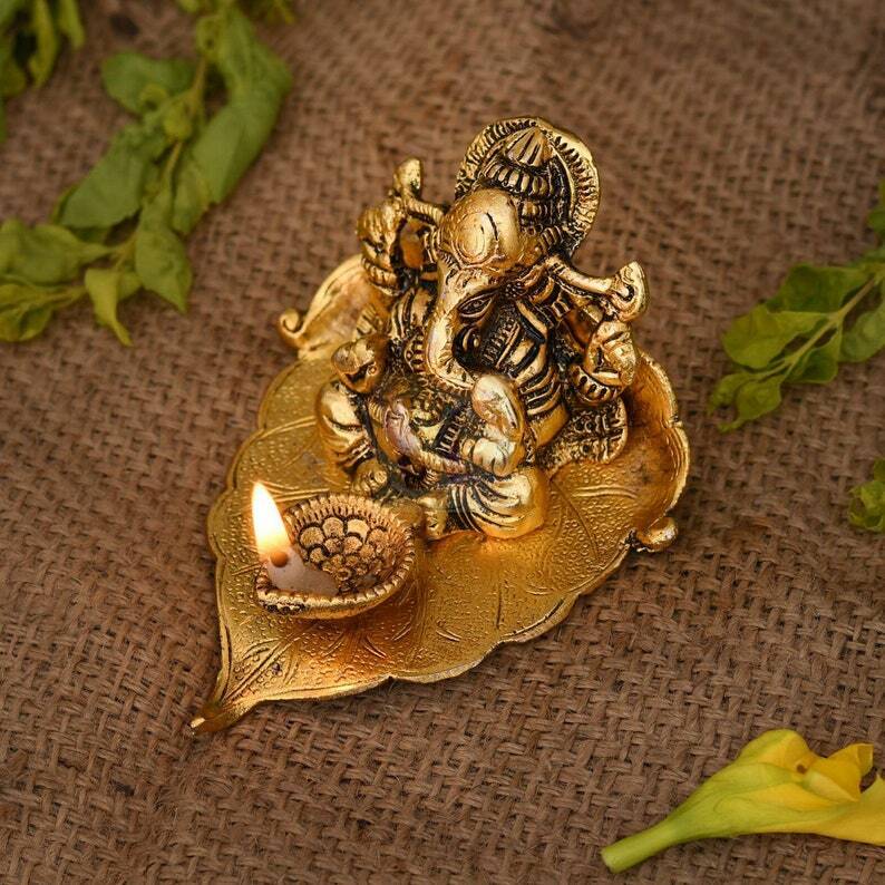 Lord Ganesh Idol Statue On Lotus Flower Diya