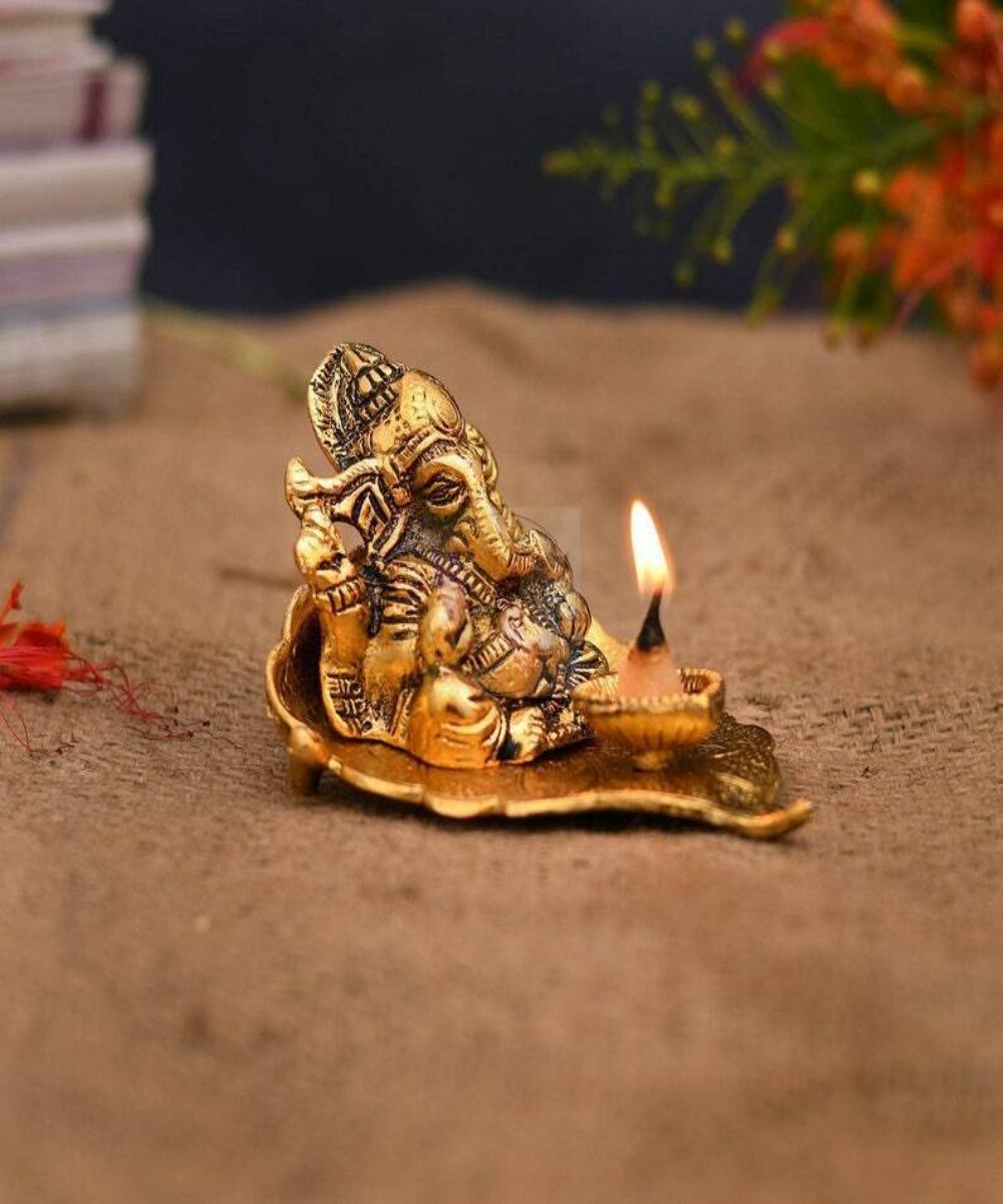 Lord Ganesh Idol Statue On Lotus Flower Diya